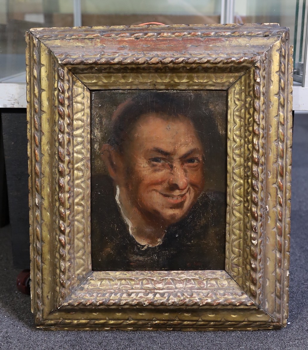 17th century Italian School , Head of a laughing man, oil on paper laid down on wood, 30 x 22cm, in a contemporary gilded wood frame.